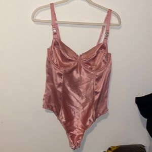Never worn Victoria’s Secret pink satin like finish body suit